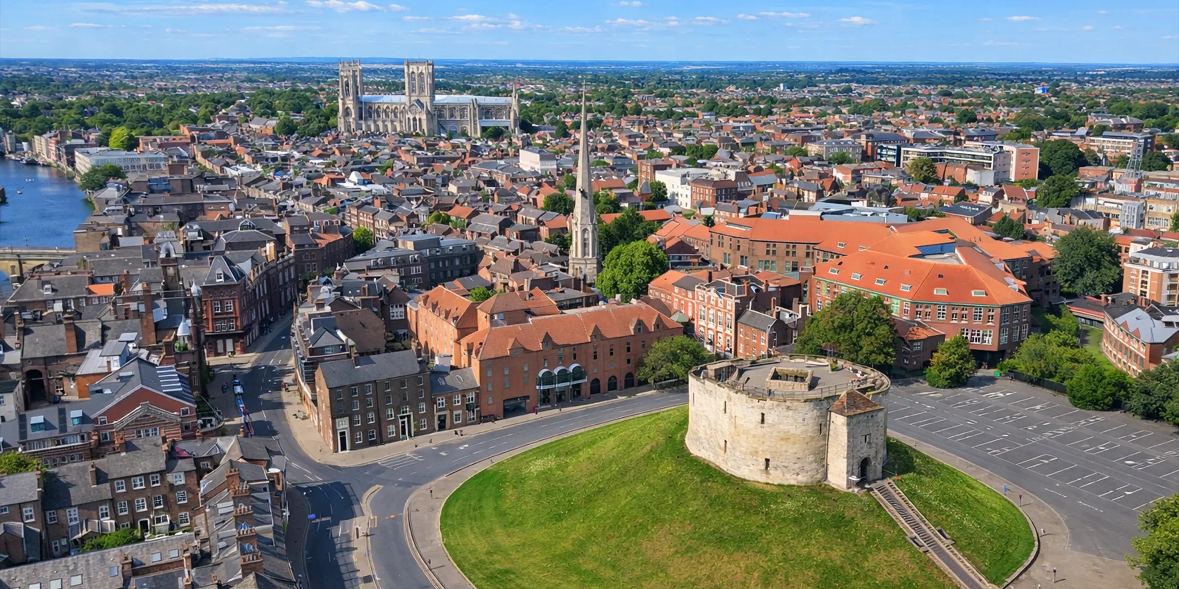 Aerial view of Clifford’s Tower and York Minster on a bright clear day in York