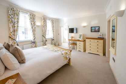 Hunter House Apartment bedroom 1 with king-size bed and bright natural light in York city centre