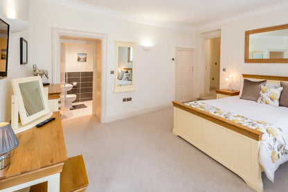 Hunter House Apartment bedroom 1 showing bed, storage and floor space in York city centre