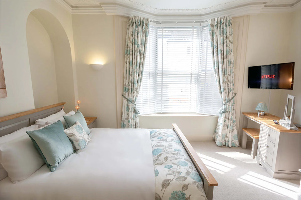 Hunter House Apartment bedroom 2 showing bed, seating and soft furnishings in York city centre