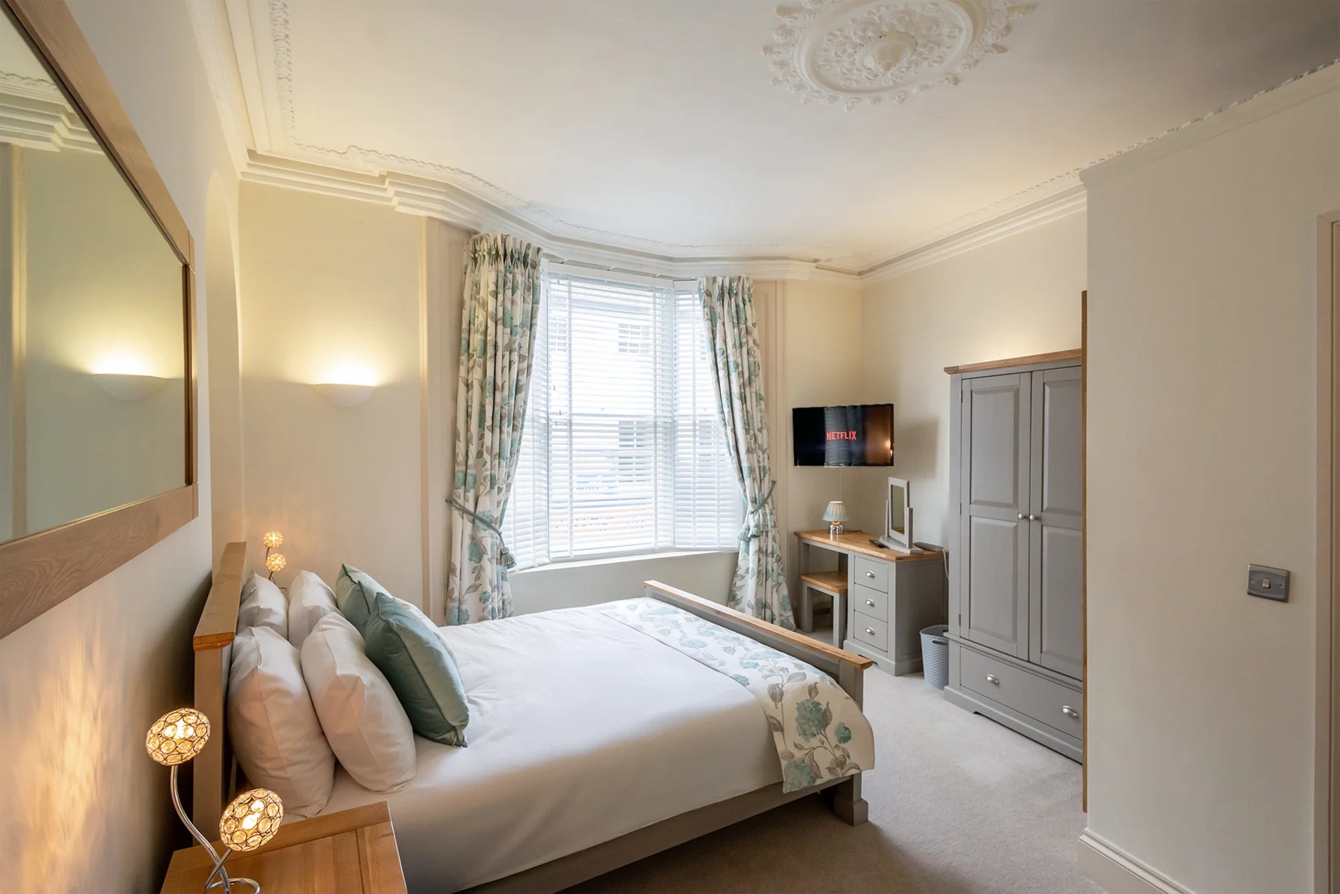 Hunter House Apartment bedroom 2 with wardrobe and bedside lighting in York city centre