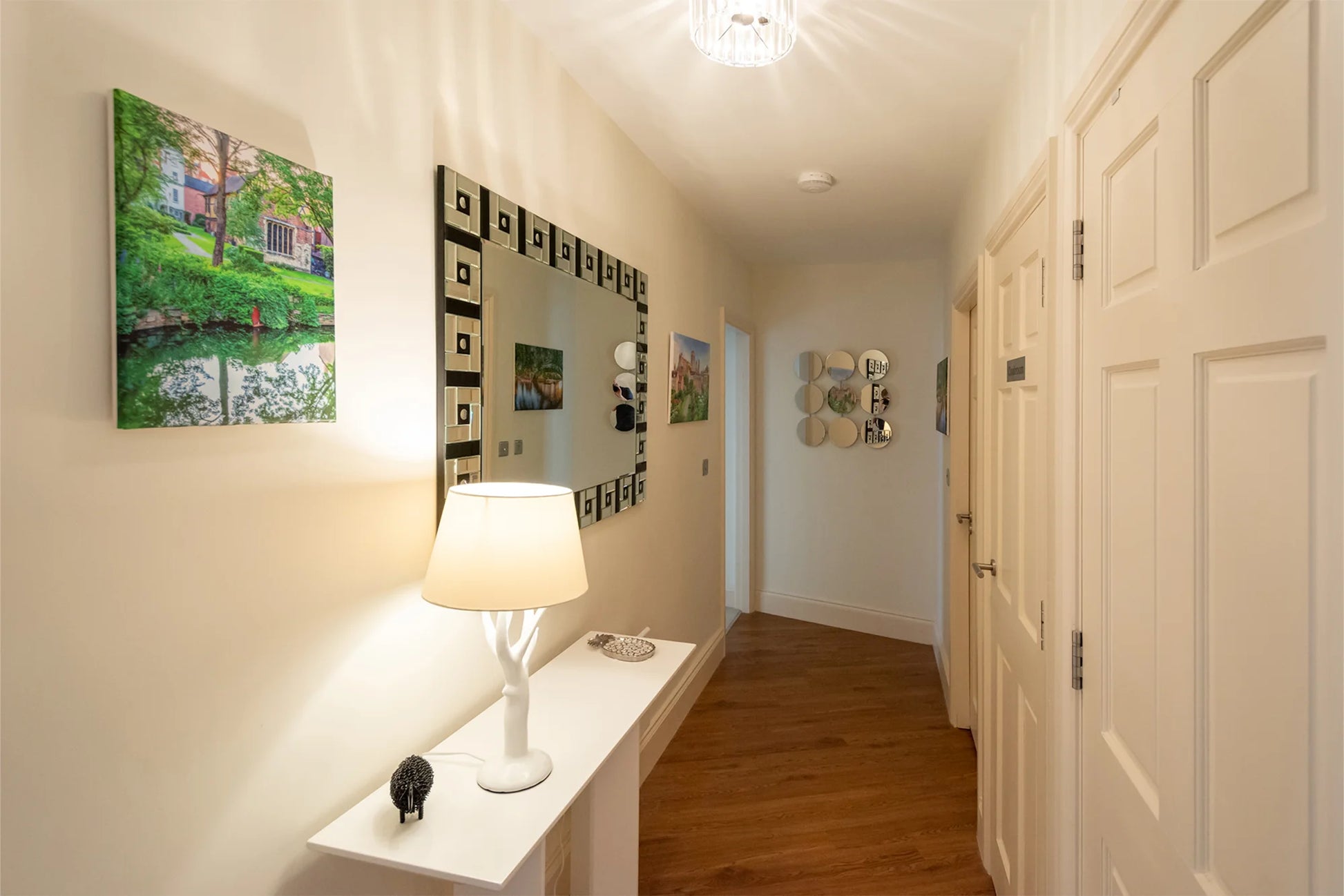 Hunter House Apartment hallway with console table and artwork in York city centre