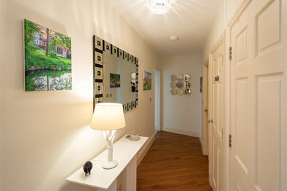 Hunter House Apartment hallway with console table and artwork in York city centre
