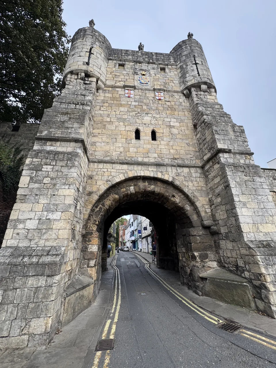 The stone arch and turrets of Bootham Bar at the entrance to High Petergate