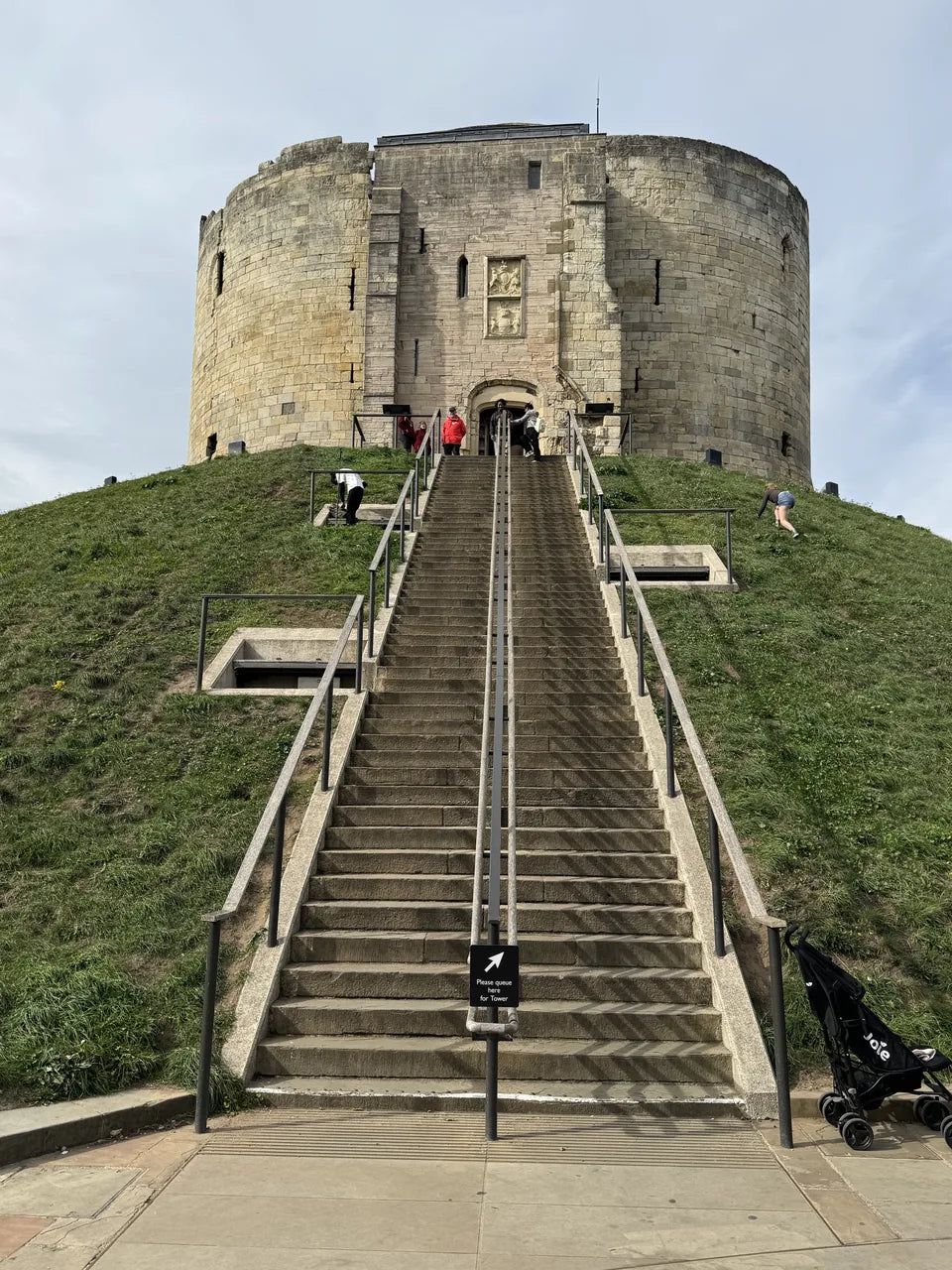 The stone keep of Clifford’s Tower above its grassy mound and entrance steps
