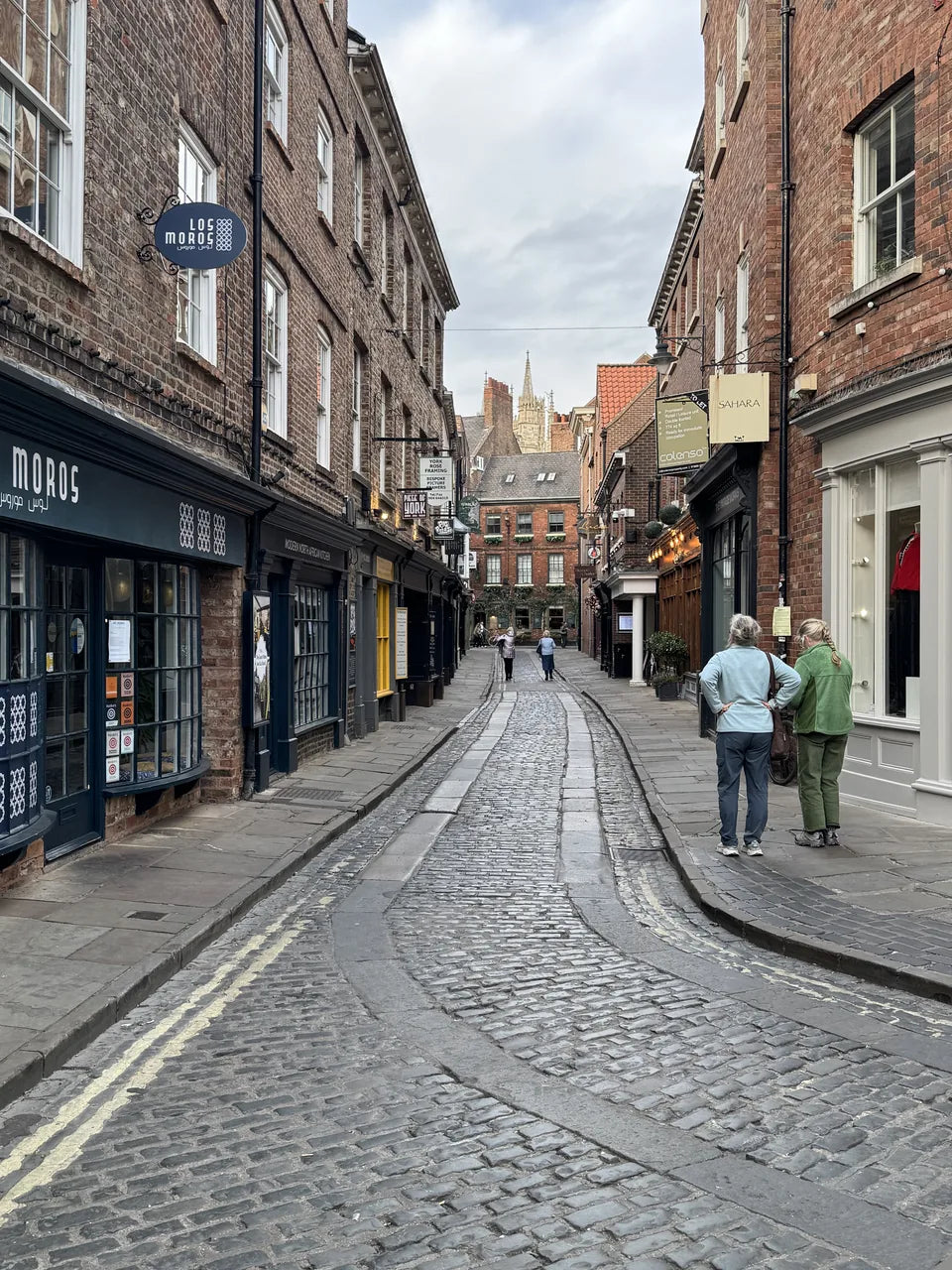 Shopfronts and curved paving along Lendal in central York