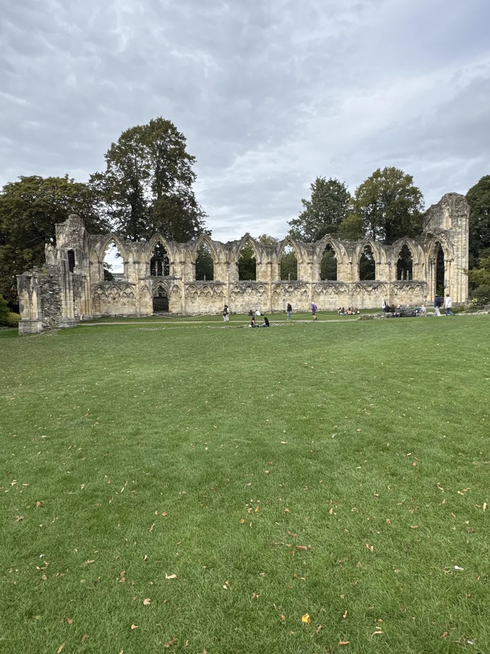 The ruined arches of St Mary’s Abbey beside the lawn in York Museum Gardens